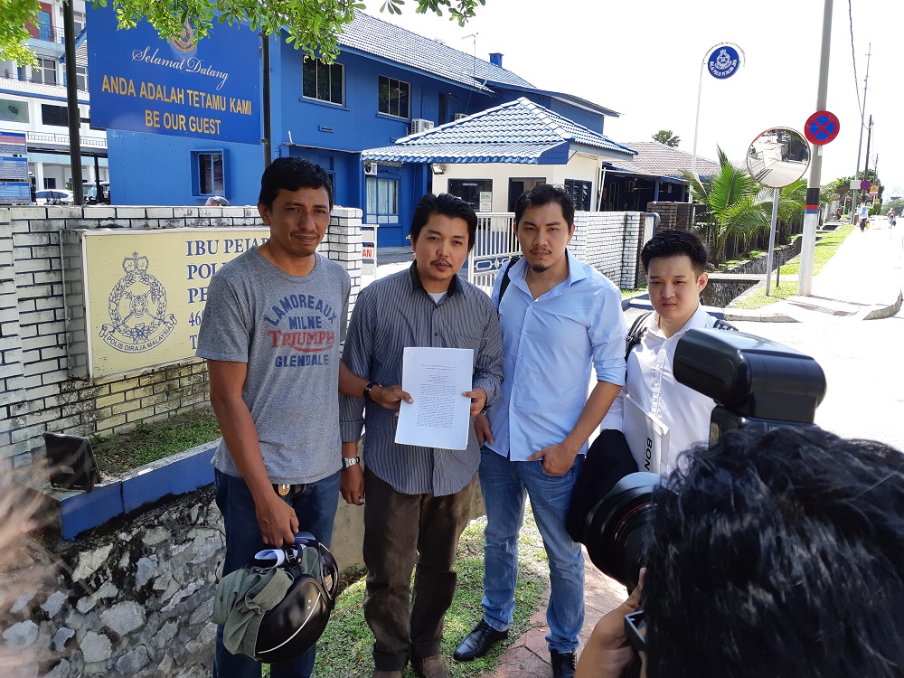 (From left) Rafzan Ramli, Khairul Amal Mahmud, and their lawyers Joshua Tay and Michael Cheah outside the Petaling Jaya district police headquarters February 23, 2019. u00e2u20acu201d Picture by Ida Lim