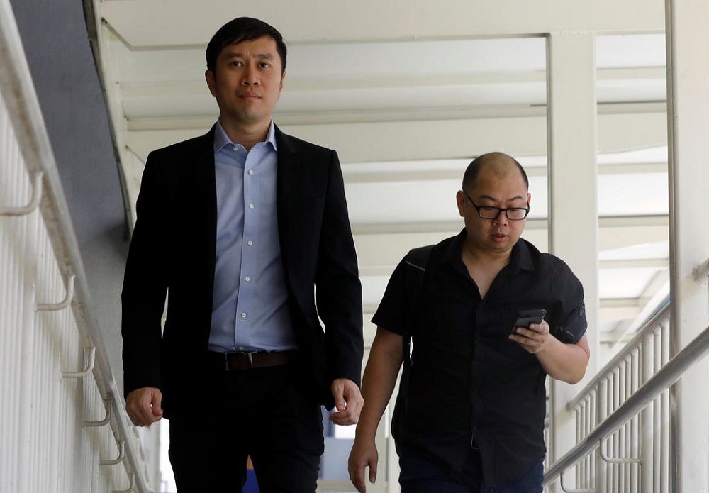 Human rights activist Jolovan Wham (left) arrives at the State Court in Singapore February 21, 2019. u00e2u20acu201d TODAY pic