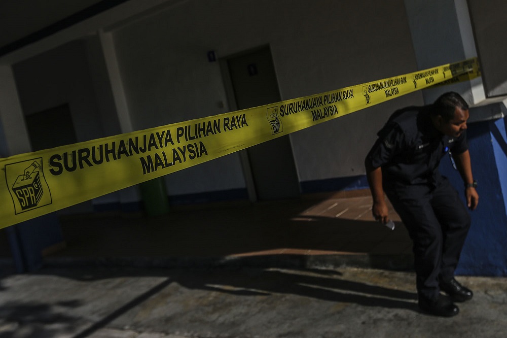 The Election Commission (EC) logo is seen on yellow tape at the Battalion 4 General Operations Force Camp in Semenyih February 26, 2019. u00e2u20acu201d Picture by Hari Anggara