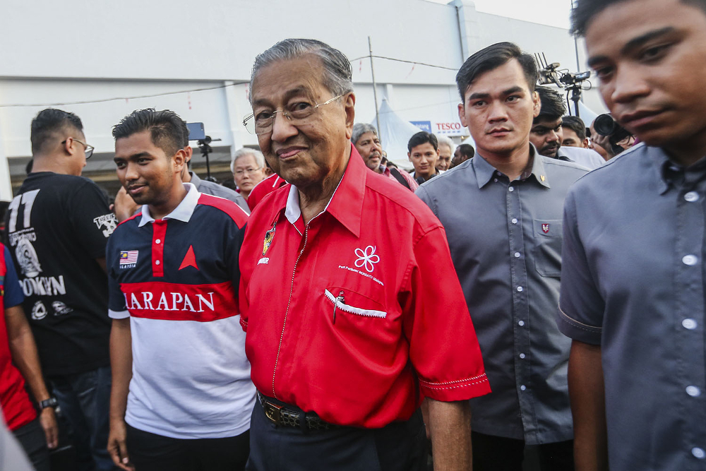 Tun Dr Mahathir Mohamad with the Pakatan Harapan candidate for Semenyih Muhamad Aiman Zainali attend the Santai 2-Roda event in Semenyih.
