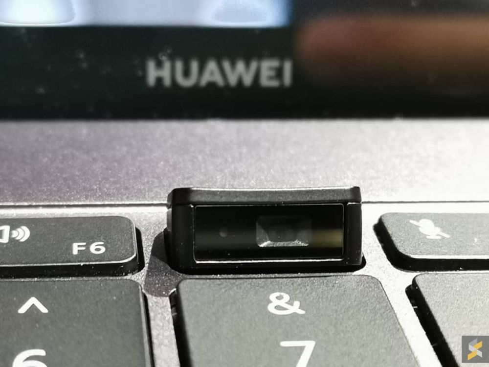 The pop-up selfie camera is still at the bottom, mounted in the middle of the function row.