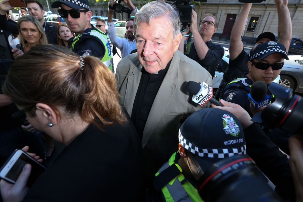 Cardinal George Pell (centre) makes his way through members of the media to the court in Melbourne February 27, 2019. u00e2u20acu201d AFP pic