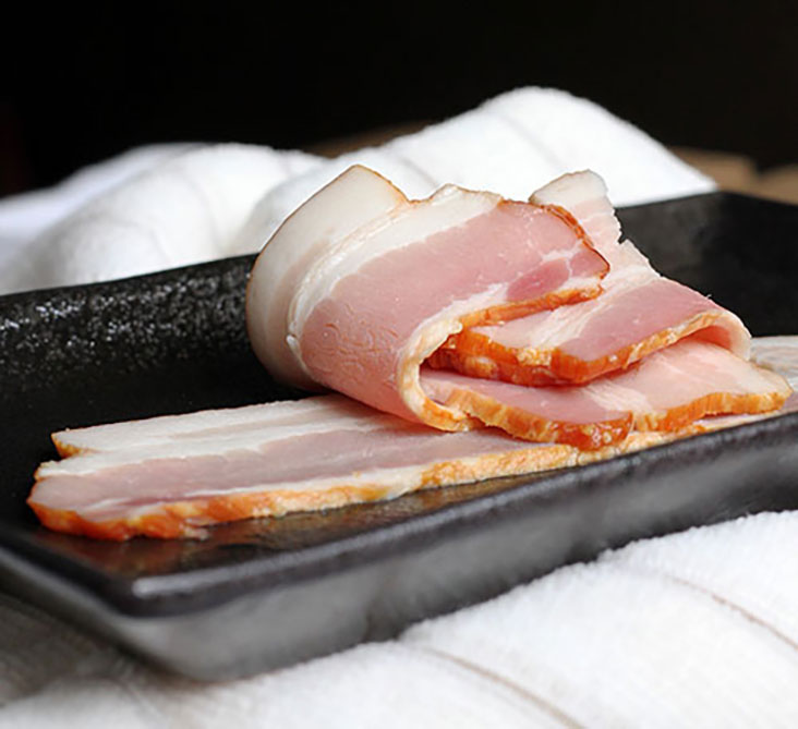 Bacon adds a decadent touch to your avocado toast.