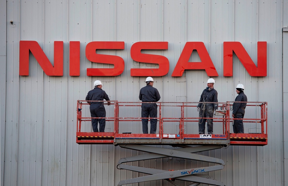 Workmen prepare to clean a large Nissan sign on the exterior of their Sunderland Plant in Sunderland, North East England November 12, 2014. u00e2u20acu201d AFP pic
