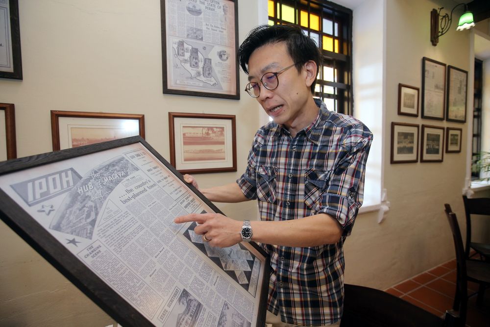 Seow shows the old newspaper articles that were published on Malaya’s Independence Day.
