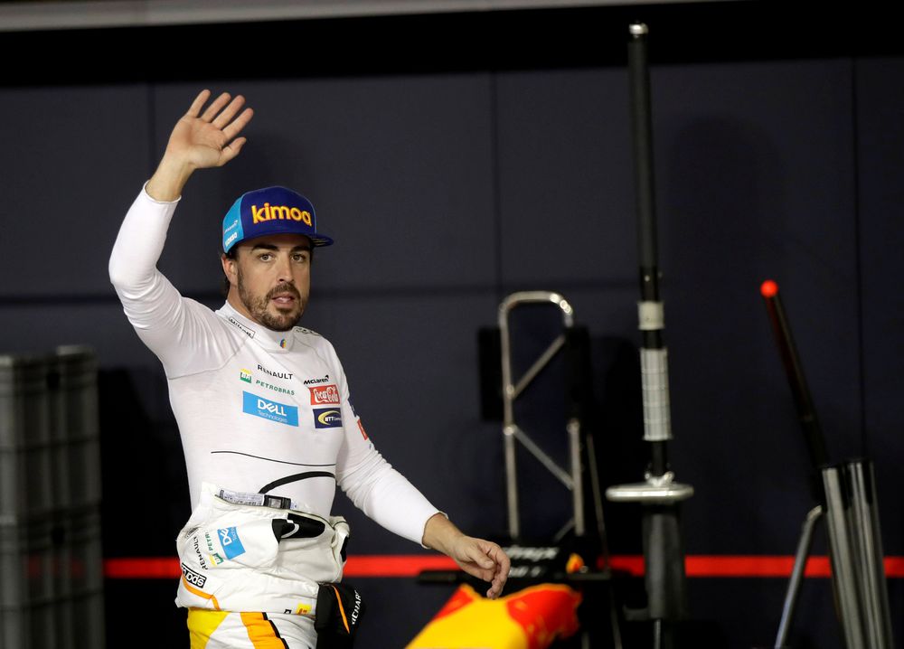 McLaren driver Fernando Alonso of Spain waves to spectators in the pit during the qualifying session at the Yas Marina racetrack in Abu Dhabi, United Arab Emirates November 24, 2018. u00e2u20acu201d Luca Bruno/ Pool picture via Reuters