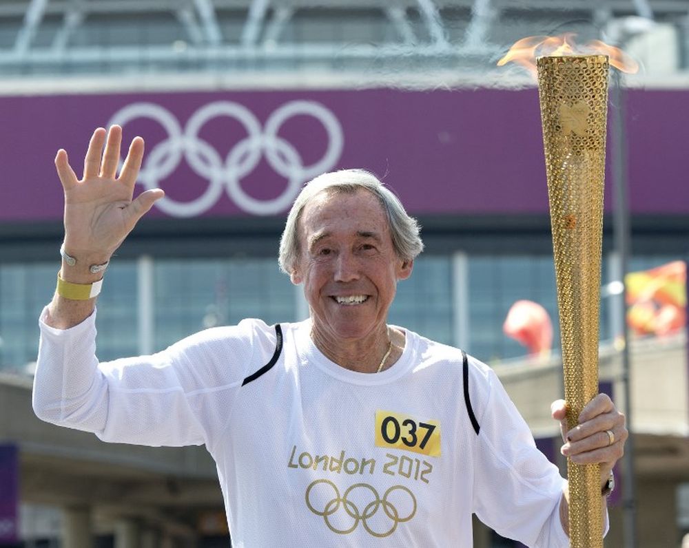 File picture shows Englandu00e2u20acu2122s former international goalkeeper Gordon Banks carrying the Olympic Torch in front of Wembley Stadium in west London on July 25, 2012. u00e2u20acu201d AFP pic