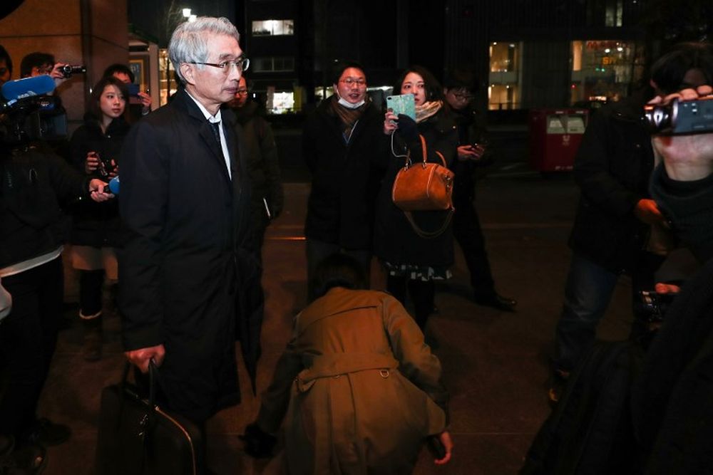 Junichiro Hironaka (left), new lawyer of former Nissan chief Carlos Ghosn, arrives at his office building in Tokyo on February 13, 2019. u00e2u20acu201d AFP pic