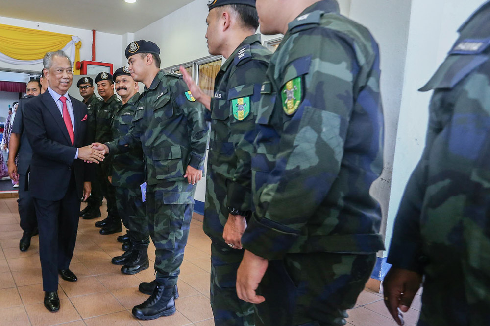 Home Minister Tan Sri Muhyiddin Yassin greets personnel at the General Operations Forces (PGA) camp in Semenyih February 12, 2019. u00e2u20acu2022 Picture by Hari Anggara