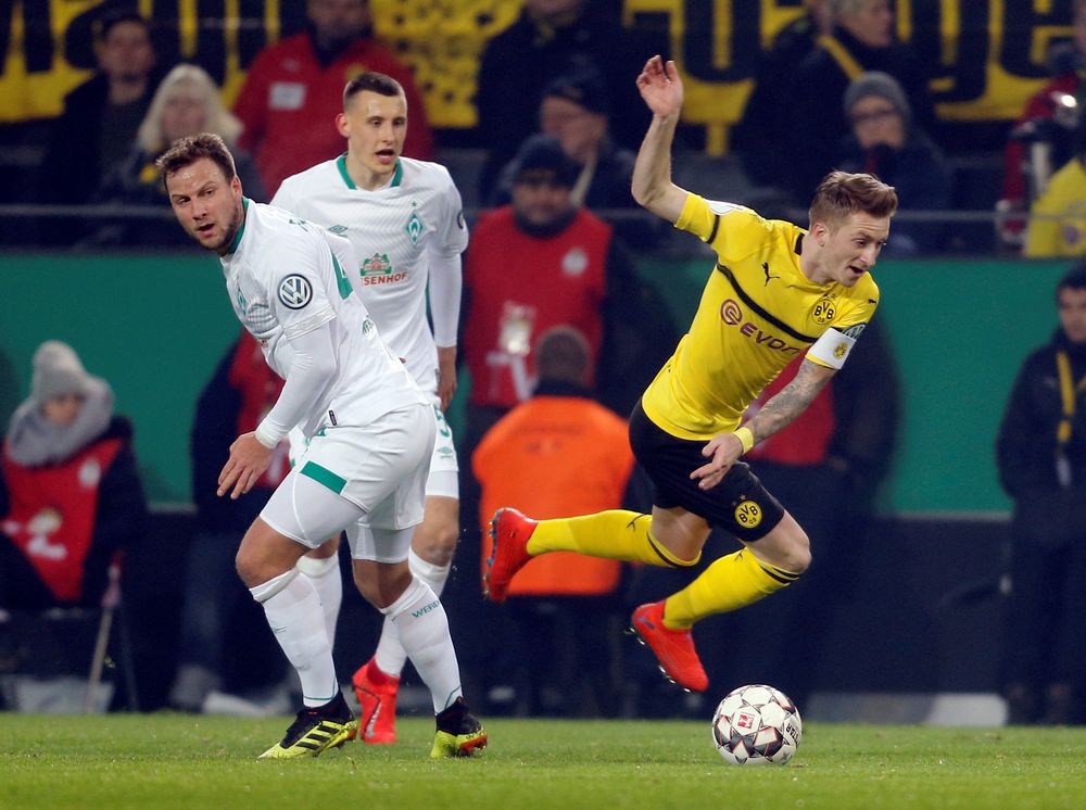 Borussia Dortmundu00e2u20acu2122s Marco Reus in action with Werder Bremenu00e2u20acu2122s Philipp Bargfrede during their DFB Cup Third Round match at Signal Iduna Park, Dortmund, Germany, February 5, 2019. u00e2u20acu201d Reuters pic