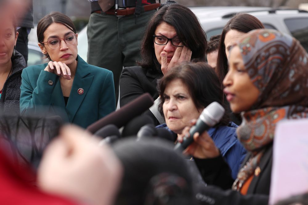 US Representative Alexandria Ocasio-Cortez (D-NY) and Representative Rashida Tlaib (D-MI) wipe away tears as Representative Ilhan Omar (D-MN) talks about her own experience as a refugee, in Washington, February 7, 2019. u00e2u20acu201d Reuters pic