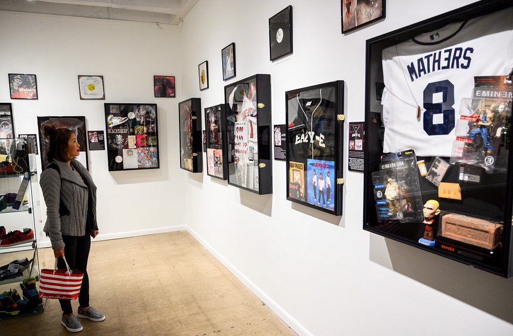In this file photo taken on January 19, 2019, guests look at memorabilia at the Hip-Hop Museum Pop Up Experience in Washington. u00e2u20acu201d AFP pic         