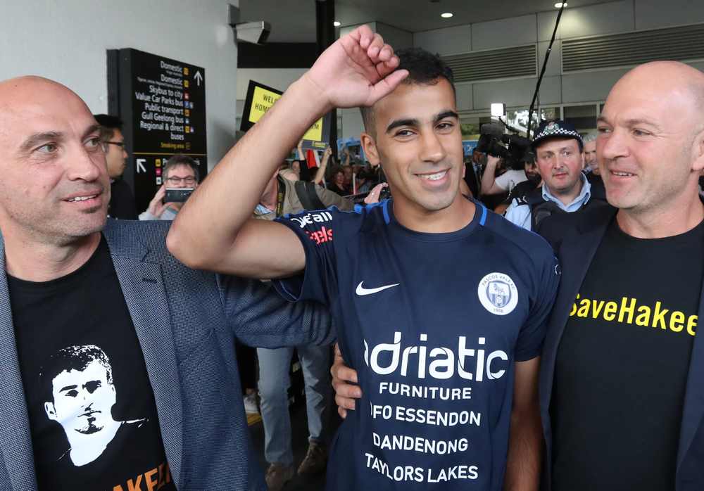 Supporters greet refugee footballer Hakeem Al Araibi (centre) as he arrives at Melbourne International Airport February 12, 2019. u00e2u20acu201d AAP Image/David Crosling via Reuters