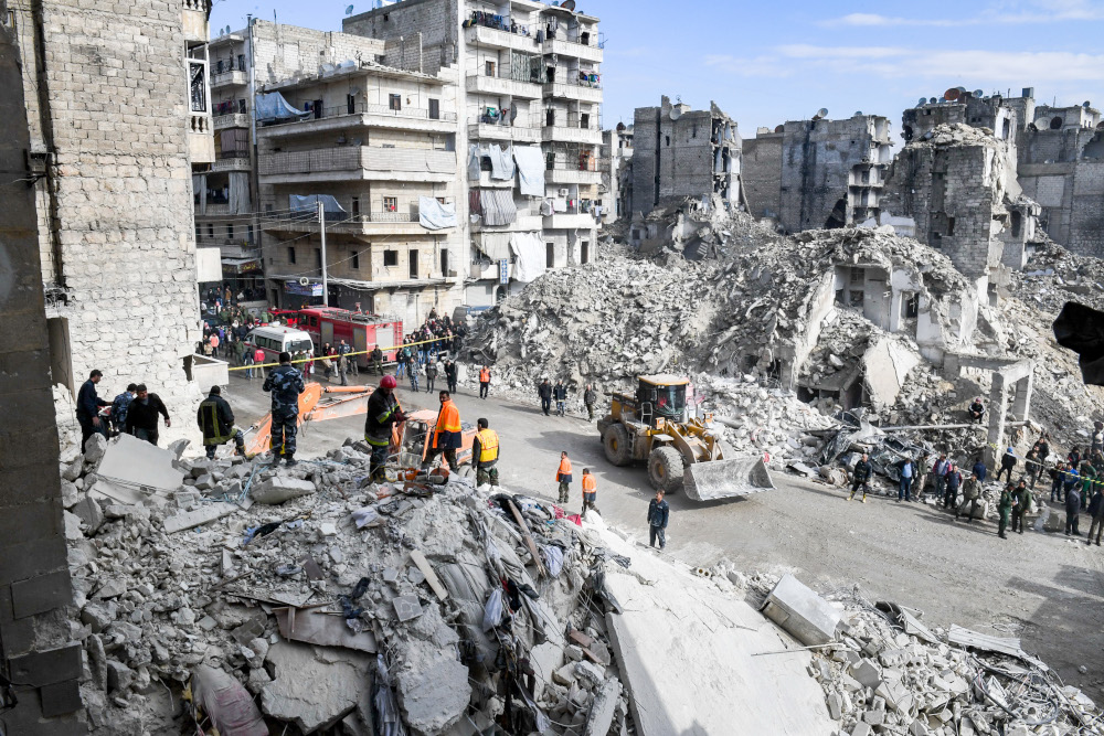 Syrian civil defence workers search the rubble of a collapsed five-storey building in the Salah al-Din district of the northern city of Aleppo on February 2, 2019. u00e2u20acu201d AFP pic 