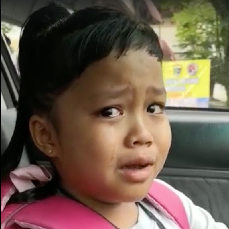 The seven-year-old was caught blowing all of her money on a copious amount of food at the school canteen. u00e2u20acu201d Screengrab from Facebook/En Wan