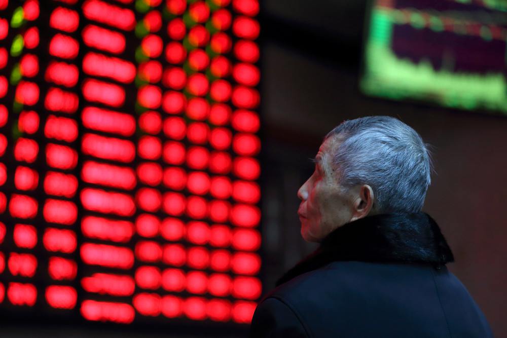 A man looks on in front of an electronic board showing stock information at a brokerage house in Nanjing, Jiangsu province, China February 13, 2019. u00e2u20acu201d Reuters pic
