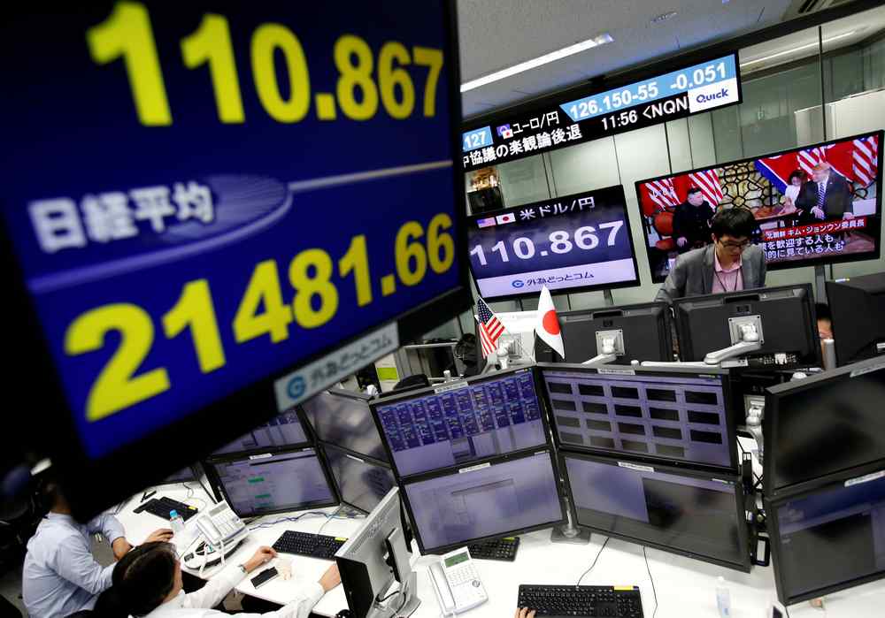 Employees of a foreign exchange trading company work next to monitors displaying Japan's Nikkei stock average and the Japanese yen's exchange rate in Tokyo February 28, 2019. u00e2u20acu201d Reuters pic