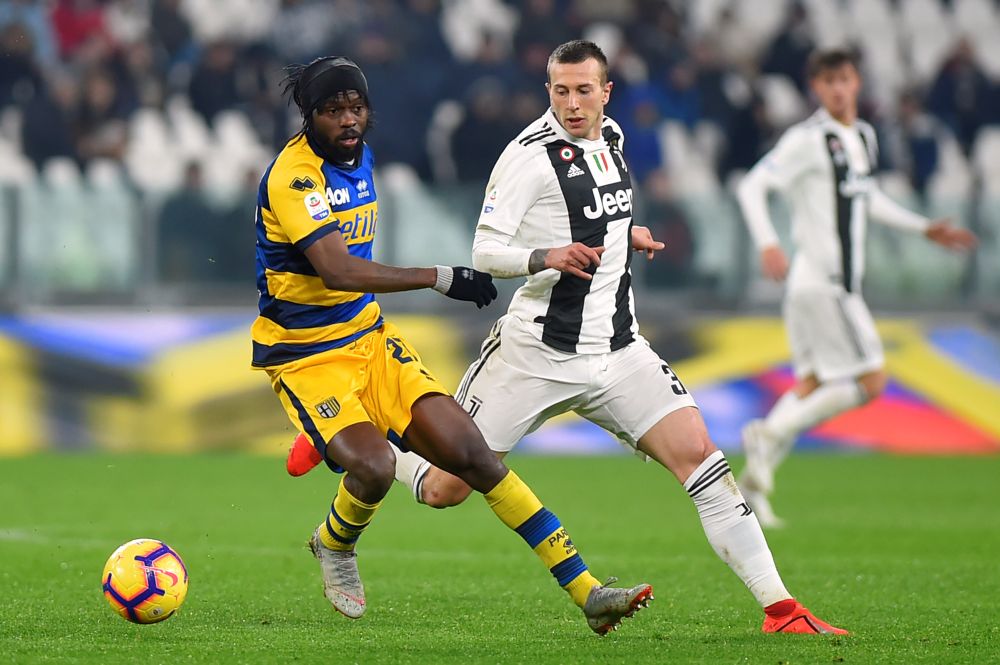 Juventus' Federico Bernardeschi in action with Parma's Gervinho (left). — Reuters pic