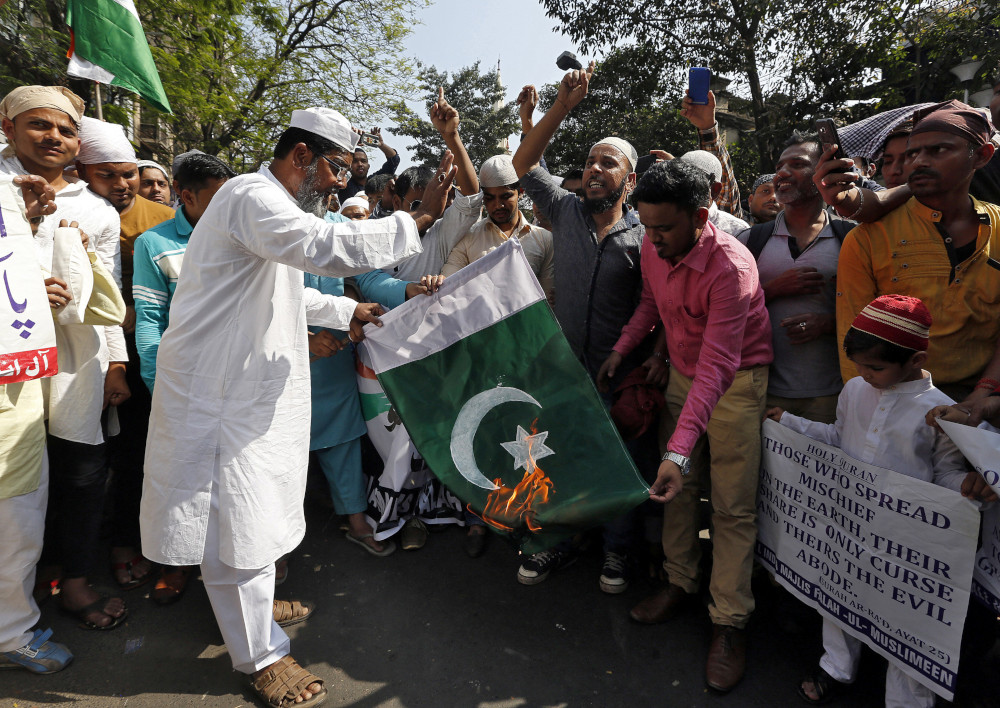 Muslims burn a Pakistani flag during a protest against the attack on a bus that killed 40 Central Reserve Police Force personnel in south Kashmir last week, outside a mosque in Kolkata, India, February 22, 2019. u00e2u20acu201d Reuters pic 