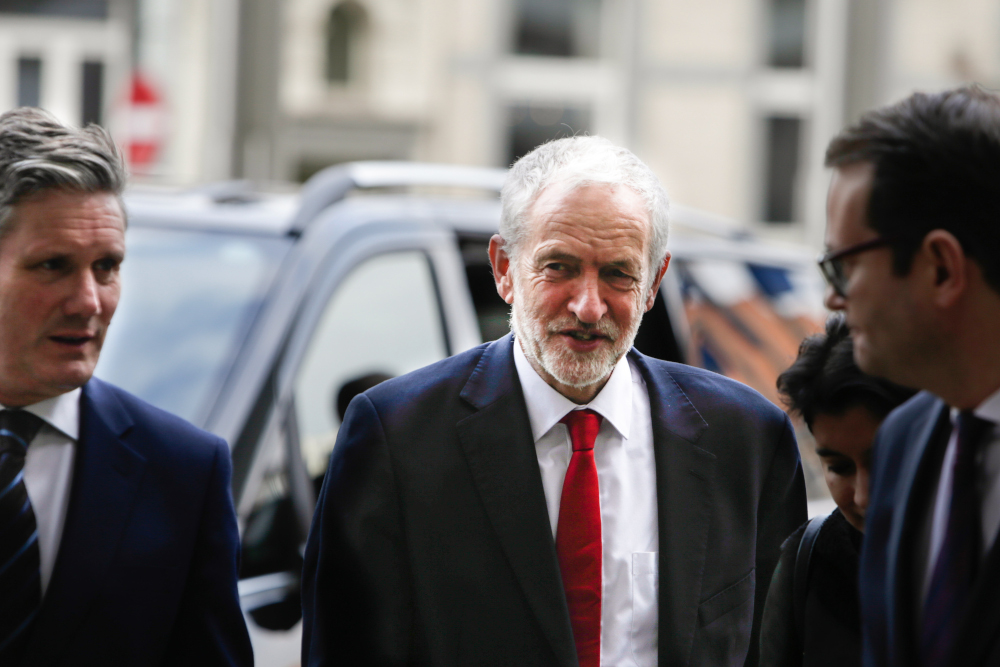 Britainu00e2u20acu2122s main opposition Labour Party leader Jeremy Corbyn (centre) arrives at the EU Commission in Brussels on February 21, 2019 ahead of a meeting with EU Brexit negotiator Michel Barnier. u00e2u20acu201d AFP pic