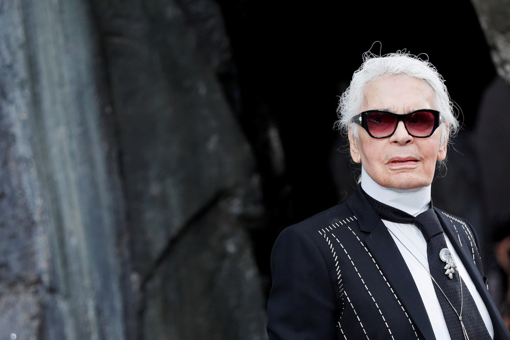 German designer Karl Lagerfeld appears at the end of his Spring/Summer 2018 womenu00e2u20acu2122s ready-to-wear collection show for fashion house Chanel at the Grand Palais during Paris Fashion Week, France, October 3, 2017. u00e2u20acu201d Reuters pic  