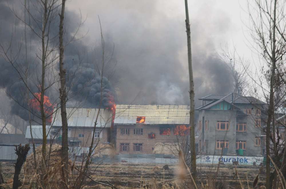A house where suspected militants were holding up is seen in flames during a gun battle with Indian security forces in Pinglan village in south Kashmir's Pulwama district February 18, 2019. u00e2u20acu201d Reuters pic