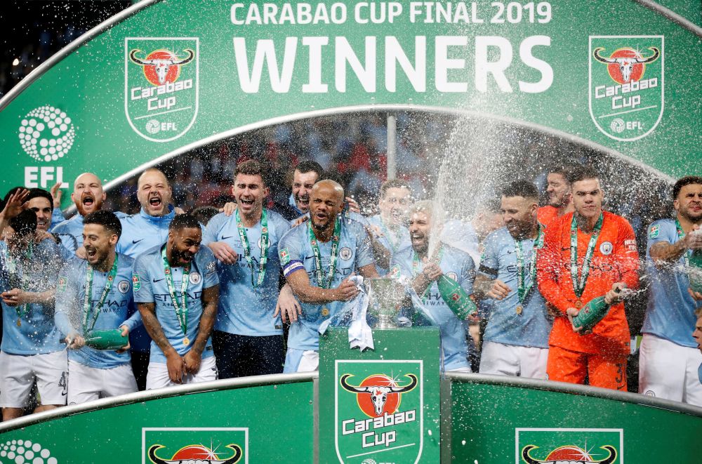Manchester City's Vincent Kompany and team mates celebrate with the League Cup trophy after the match Chelsea, February 24, 2019. u00e2u20acu2022 Reuters pic
