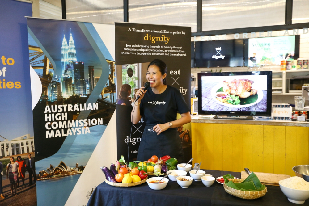 Diana Chan speaks to guests about the dish at the Eat X Dignity cafe. — Picture by Ahmad Zamzahuri