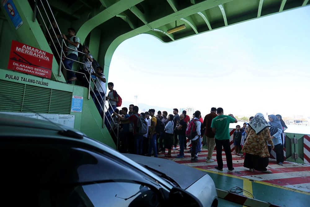 People are seen onboard a ferry bound for Penang island, February 7, 2019. u00e2u20acu2022 Picture by Sayuti Zainudin