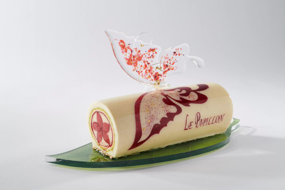 ‘La Papillon’ means ‘The Butterfly’ in French. 