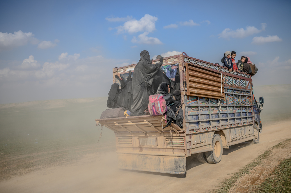 This picture taken on February 22, 2019 shows a convoy of trucks transporting people who fled the Islamic State (IS) groupu00e2u20acu2122s last holdout of Baghouz in Syriau00e2u20acu2122s northern Deir Ezzor province. u00e2u20acu201d AFP pic 