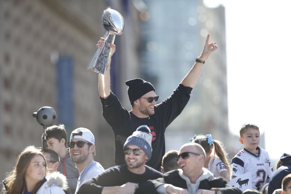 New England Patriots quarterback Tom Brady (12) holds up the Vince Lombardi Trophy during the Super Bowl LIII championship parade through downtown Boston. u00e2u20acu2022 Picture by Greg M. Cooper-USA TODAY Sports via Reuters