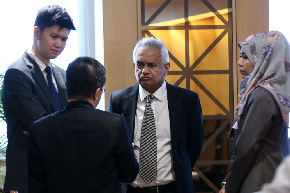 Attorney General Tommy Thomas (centre) is pictured during a tribunal hearing on the misconduct of former Election Commissioners at the Asian International Arbitration Centre in Kuala Lumpur February 28, 2019. u00e2u20acu201d Picture by Ahmad Zamzahurinn