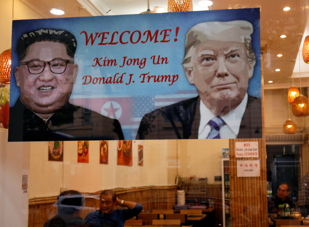 A welcoming banner with images of US President Donald Trump and North Korean leader Kim Jong-un hangs at a South Korean restaurant ahead of USA-DPRK summit in Hanoi, Vietnam February 22, 2019. u00e2u20acu201d Reuters pic 