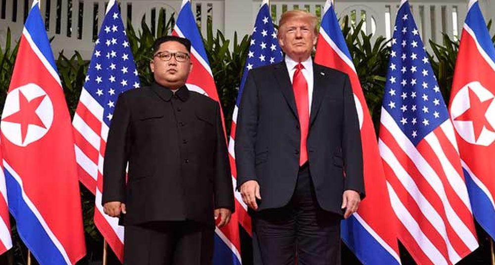 File picture shows US President Donald Trump posing with North Koreau00e2u20acu2122s leader Kim Jong-un at the start of their historic US-North Korea summit, June 12, 2018. u00e2u20acu201d AFP pic