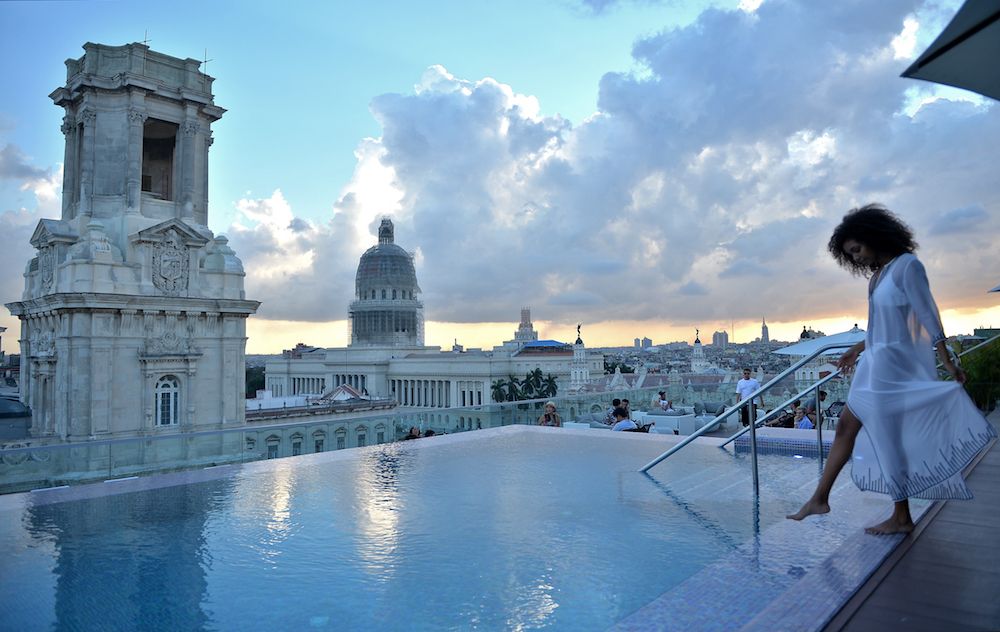 A tourist stands by the swimming pool on the rooftop of the Gran Manzana Hotel in Havana February 11, 2019. u00e2u20acu201d AFP pic