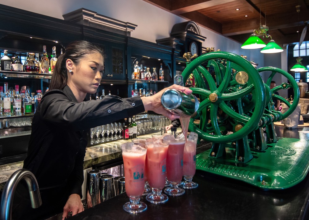 A bar staff prepares u00e2u20acu02dcSingapore Slingu00e2u20acu2122 cocktails for customers at a bar in Singapore January 25, 2019. u00e2u20acu201d AFP pic