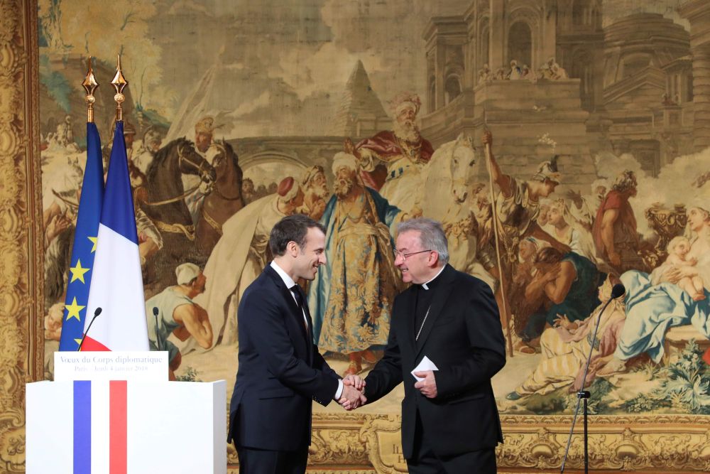 French President Emannuel Macron (left) shakes hands with Apostolic Nuncio to France Luigi Ventura during his New Year wishes to the diplomatic corps January 4, 2018, at the Elysee Palace in Paris. u00e2u20acu201d AFP pic