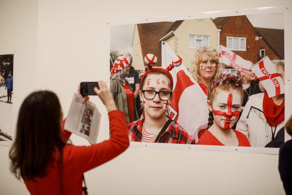 A visitor takes a photo of a photograph displayed at the u00e2u20acu02dcOnly Human: Photographsu00e2u20acu2122 by Martin Parr exhibition during the press preview at National Portrait Gallery in London March 6, 2019. u00e2u20acu201d Tolga Akmen pic via AFP