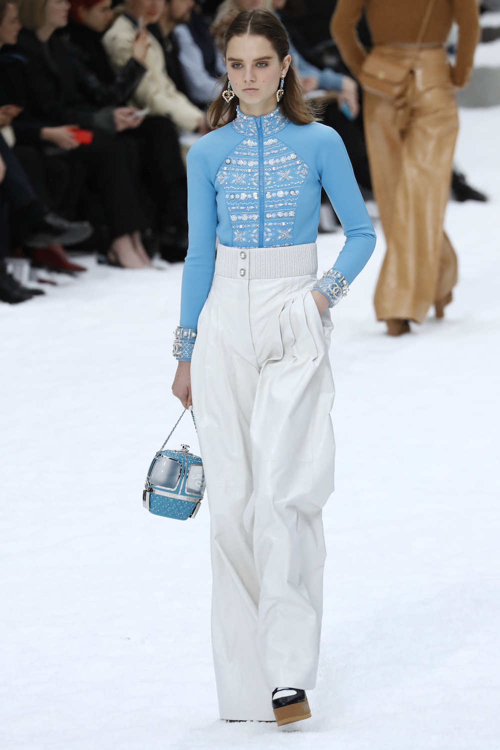 Giselle Norman presents a creation by Chanel during the Women's Fall-Winter 2019/2020 Ready-to-Wear collection fashion show at the Grand Palais turned into a wintry village in Paris March 5, 2019. u00e2u20acu201d AFP pic