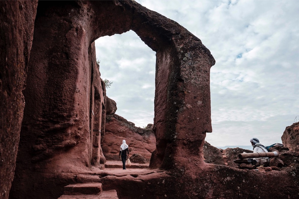 An Ethiopian Orthodox devotee walks near the rock-hewn church of Saint Mercurius in Lalibela, Ethiopia March 7, 2019. u00e2u20acu201d AFP pic