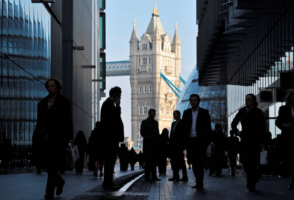 Office workers are seen in the London Place business district near Tower Bridge in central London February 9, 2011. u00e2u20acu201d Reuters pic