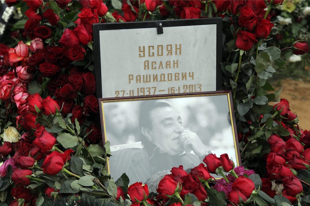 In this file photo taken on January 20, 2013 the grave of Russian crime boss Aslan Usoyan is covered in flowers at Hovanskoye cemetery in Moscow. u00e2u20acu201d AFP pic