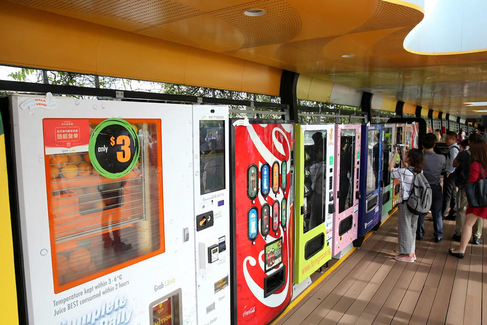 Some of the 35 newly launched vending machines along the Sentosa Boardwalk that sells more than just food and drinks. u00e2u20acu201d TODAY pic