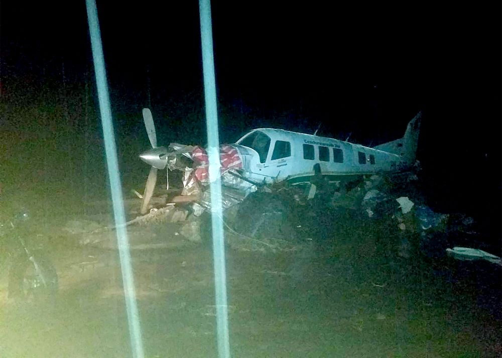 This handout picture taken March 17, 2019 shows a small plane on an airstrip surrounded by floodwaters in Sentani, near the provincial capital of Jayapura, triggered by torrential rain. u00e2u20acu201d Handout/Badan Nasional Penanggulangan Bencana (BNBP) via AFP