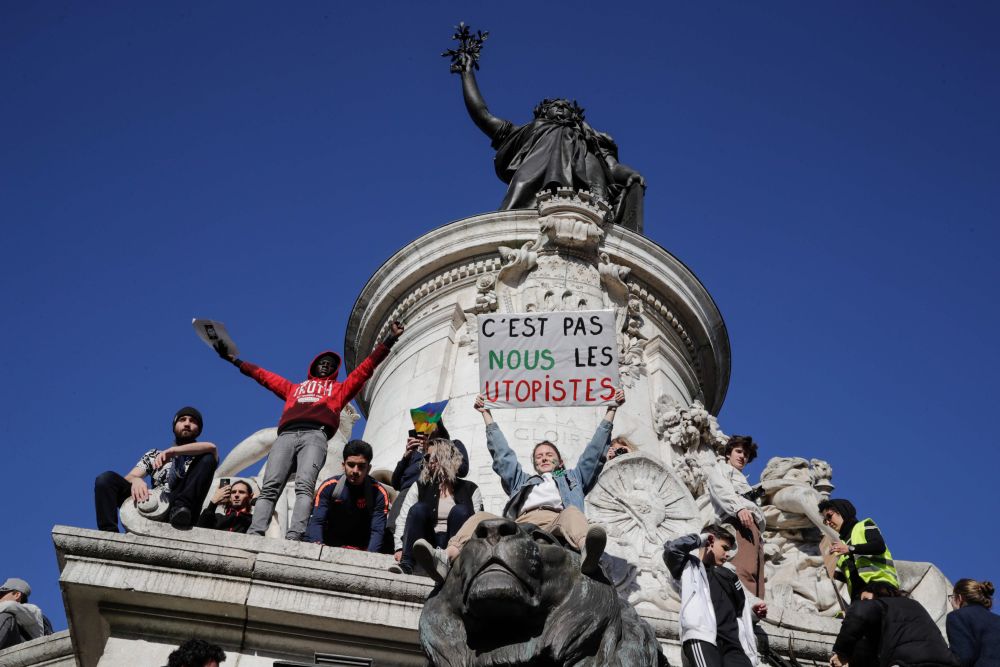 Protesters climb on the statue and hold a sign reading u00e2u20acu02dcits not us the Utopiansu00e2u20acu2122 as they take part in the u00e2u20acu02dcMarch of The Centuryu00e2u20acu2122 to demand answers to climate change at Place de la Republique in Paris March 16, 2019. u00e2u20acu201d AFP pic