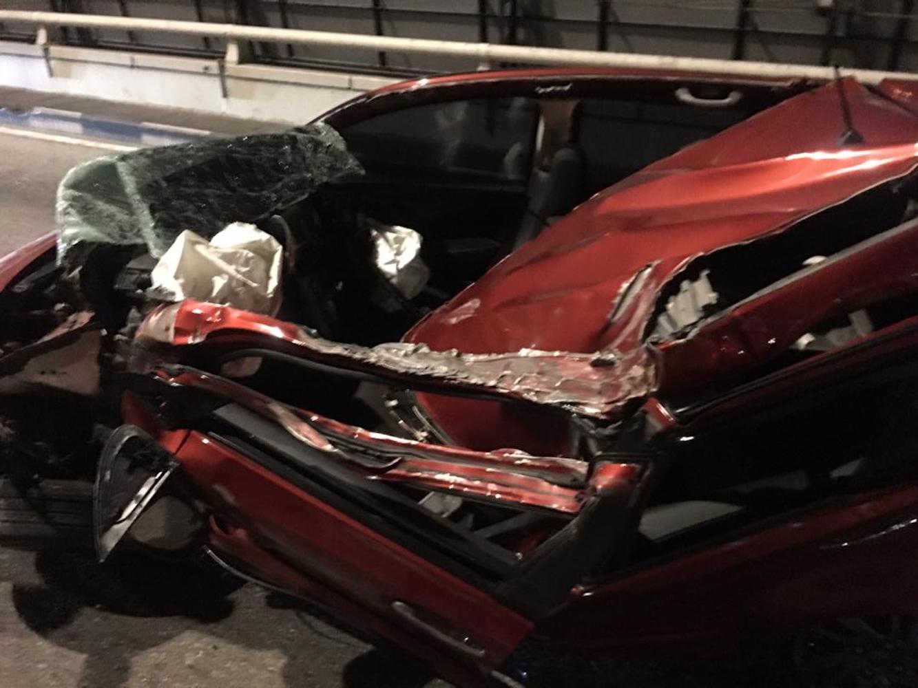 Nur Mohd Azriyn Ayub Azriynu00e2u20acu2122s Perodua Myvi is seen after his collision with a truck. 