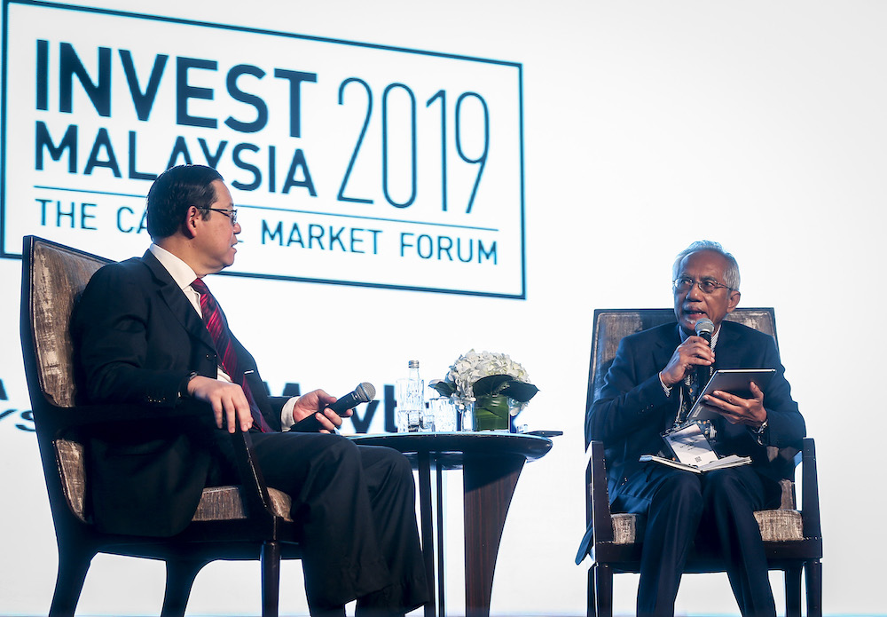 Finance Minister Lim Guan Eng and the Prime Minister's Special Advisor on Media and Communications, Datuk A. Kadir Jasin  at the Invest Malaysia 2019 conference in Kuala Lumpur March 19, 2019. u00e2u20acu201d Picture by Firdaus Latif