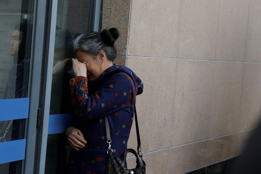 A relative of a passenger aboard Malaysia Airlines flight MH370 reacts as she waits for a state representative outside the Chinese ministry of foreign affairs in Beijing March 8, 2019. u00e2u20acu201d Reuters pic