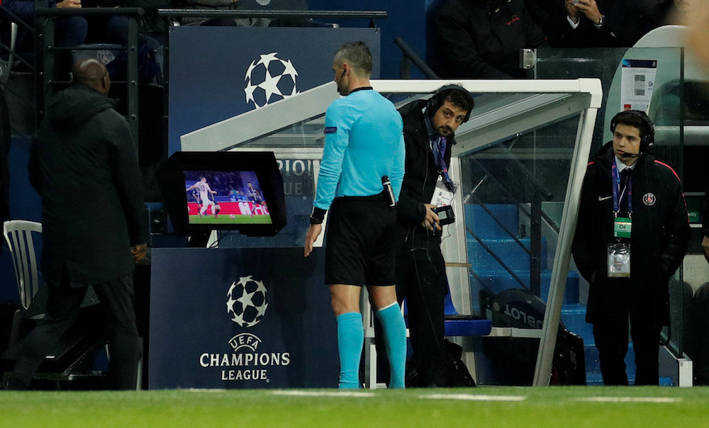 Referee Damir Skomina reviews an incident on VAR before awarding a penalty to Manchester United during their Champions League round of 16 second leg match with Paris St Germain in Paris March 6, 2019. u00e2u20acu201d Action Images pic via Reuters